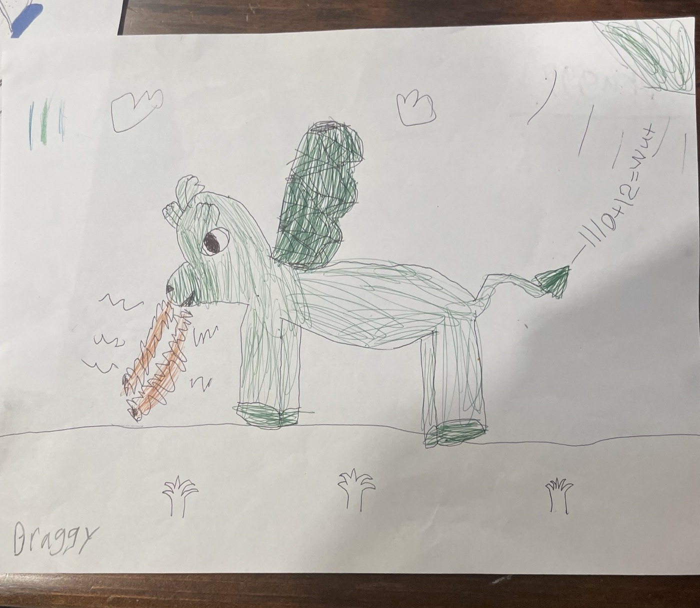 A child's drawing of a green dragon named Draxy, with math problems and electric eels